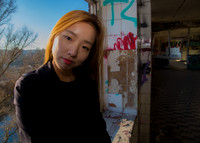 Portrait of So Hee framed in a doorway in Hanover, Germany