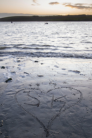Romantic coastal portrait of a couple photographed in Cork, Ireland