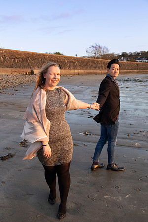 Beachside portrait of a couple during an engagement session in Cork, Ireland