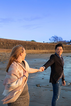 Coastal engagement portrait of a couple on a beach in Cork, Ireland