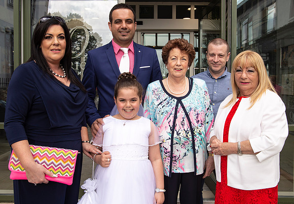 First Communion celebration with family photographed at Talbot Hotel in Ballincollig, Cork, Ireland by FlashFocus.org